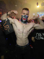 A  Masculine Guy in a rave party wearing venom rave mask